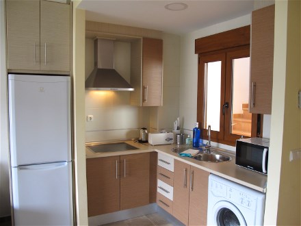 The modern, open kitchen has all needs.