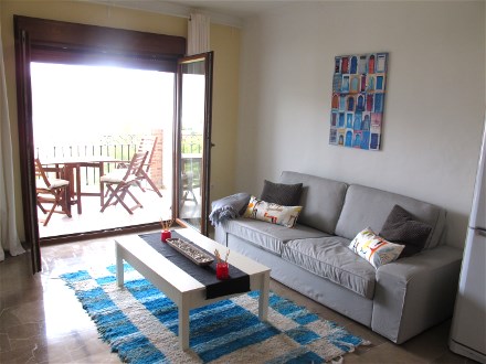 The living room is well furnished and has Sat TV